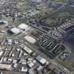 Oblique aerial view of the Glasgow Commonwealth games site including Celtic Park Stadium, looking to the E.
