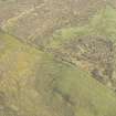 Oblique aerial view of the site of pillboxes and trenches, looking SE.