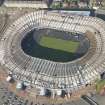 Oblique aerial view of Hampden Park being converted to a Commonwealth games venue, looking to the N.