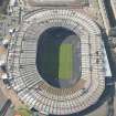 Oblique aerial view of Hampden Park being converted to a Commonwealth games venue, looking to the W.