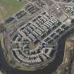Oblique aerial view of of the Glasgow Commonwealth Games site including the athlete's village, looking to the WNW.