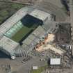 Oblique aerial view of of Parkhead football stadium, looking to the E.