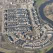 Oblique aerial view of of the Glasgow Commonwealth Games site including the athlete's village, looking to the NW.