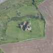 Oblique aerial view of Torthorwald Castle, looking E.