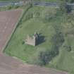 Oblique aerial view of Torthorwald Castle, looking NNW.