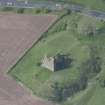 Oblique aerial view of Torthorwald Castle, looking NW.