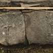View of recumbent slab with incised cross (including scale)