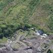 Oblique aerial view of Auchinvole Castle, looking SSE.