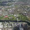 Oblique aerial view of Radio 1's Big Weekend at Glasgow Green, Nelson Monument and People's Palace, looking NNE.