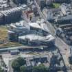 Oblique aerial view of the Scottish Parliament, looking W.