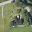 Oblique aerial view of Dyce Old Parish Church and Burial Ground, looking W.