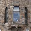 Detail of ornate first floor windows above doorway to 92 Grove Street/158-164 Fountainbridge, Edinburgh, taken from the east.
