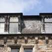 Detail of ornate third floor windows on 158-164 Fountainbridge/92 Grove Street, Edinburgh, taken from the south.