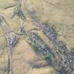 Oblique aerial view of the mining remains and Leadhills village, looking SW.
