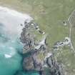 Oblique aerial view of Dun Nighean on the Isle of Tiree, looking N.