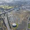 Oblique aerial view of Provan Gasworks including gasholders, looking SW.
