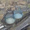 Oblique aerial view of Provan Gasworks including gasholders, looking N.