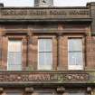 Detail of inscriptions and windows on south west elevation of school.
