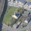 Oblique aerial view of Kilmarnock Old High Kirk and Kirkyard, looking W.