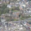 Oblique aerial view of Mauchline Old Church and Mauchline Castle, looking NNW.