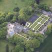 Oblique aerial view of Carlowrie Country House, walled garden, stable block and Westfield Steading, looking SSW.
