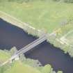Oblique aerial view of Ballindalloch railway bridge, looking NNW.