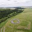 Oblique aerial view of Edin's Hall centred on the broch, looking NE.