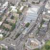 Oblique aerial view of Leith Waterworld, Leith Academy Primary School and Leith Central Station Offices, looking NW.