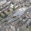 Oblique aerial view of Leith Waterworld, Leith Academy Primary School and Leith Central Station Offices, looking N.
