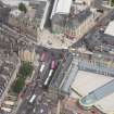 Oblique aerial view of the Palace Cinema and Leith Central Station Offices, looking NE.