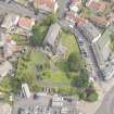 Oblique aerial view of St Triduana's Chapel, Restalrig Parish Church and Churchyard, looking NE.