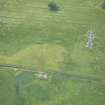Oblique aerial view of the cropmarks of the rectilinear enclosure, looking W.