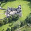 Oblique aerial view of Tolquhon Castle, looking ENE.