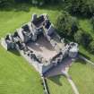 Oblique aerial view of Tolquhon Castle, looking SW.