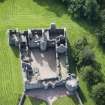 Oblique aerial view of Tolquhon Castle, looking SSE.