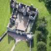 Oblique aerial view of Tolquhon Castle, looking SE.