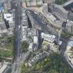 Oblique aerial view of Waterloo Place, Calton Hill Bridge and Leith Street, looking WSW.