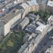 Oblique aerial view of the High Street, Trinity College Church and John Knox's House, looking NE.