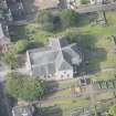 Oblique aerial view of Canogate Tolbooth and Canongate Parish Church, looking W.