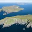 General oblique aerial view of Berneray and Mingulay with Barra Head in the foreground, looking NNE.