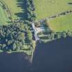 Oblique aerial view of Dunecht House Towerlodges, gates and boathouse, looking NE.