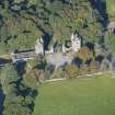 Oblique aerial view of Dunecht House Tower lodges, gates and boathouse, looking WNW.