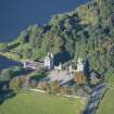 Oblique aerial view of Dunecht House Tower lodges, gates and boathouse, looking WSW.