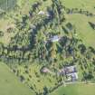 Oblique aerial view of Mayen House stables and walled garden, looking NW.