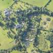 Oblique aerial view of Mayen House stables and walled garden, looking S.