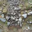 Mid-excavation image of north end of Trench 2 - showing the slight dip in the rubble (possible intramural cell) in the back centre of the image, Comar Wood Dun, Cannich, Strathglass