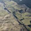 Oblique aerial view of the field systems and rig extending from Dalmunzie Hotel to Spittal of Glenshee, looking SE.