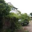 View of curved garden wall flanking driveway, photograph from a historic building appraisal at Muirfield Gate, Duncur Road, Gullane
