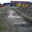 Trench 3 - Concrete foundations, photograph from final report on an archaeological evaluation at Main Street, Bridgeton