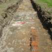 Trench 4 - Surface and wall, photograph from final report on an archaeological evaluation at Main Street, Bridgeton